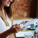 Client reading and signing legal document